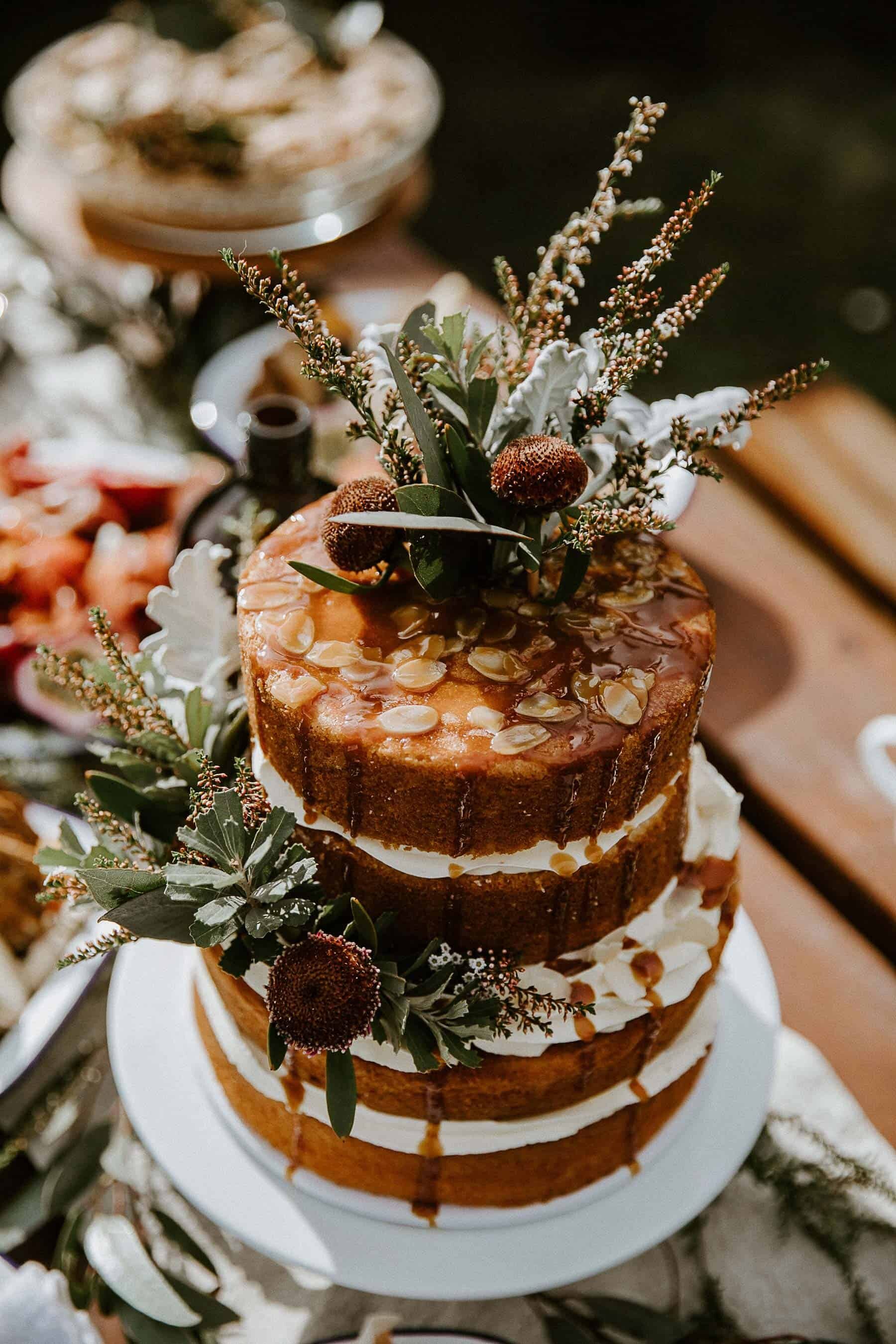 rustic naked layer cake with native flowers