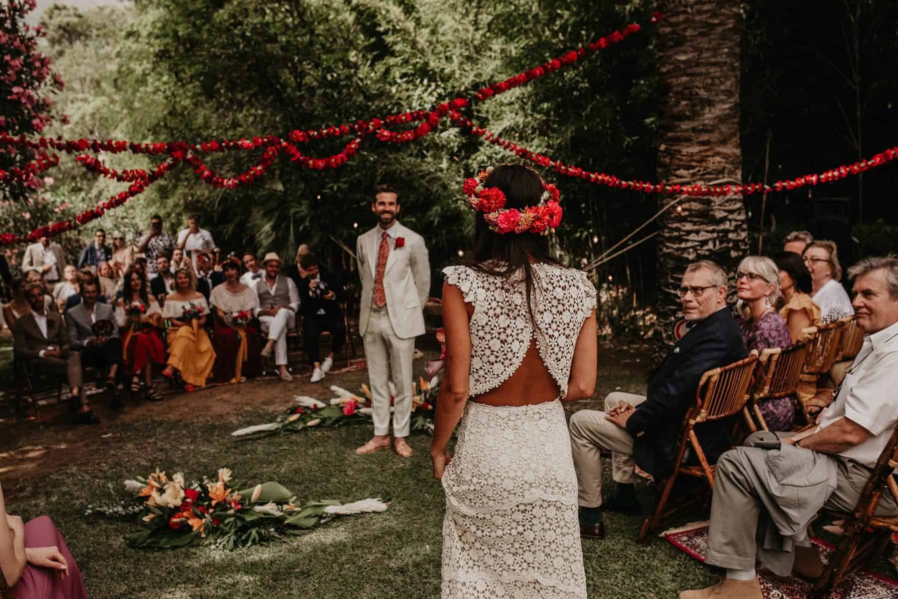 boho bride in two piece crochet wedding dress and Frida Kahlo flower crown
