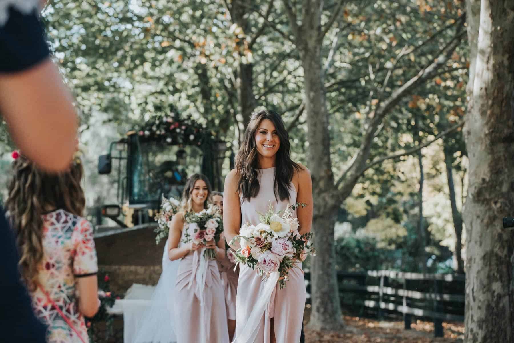 modern blush bridesmaid dresses and wild bouquets