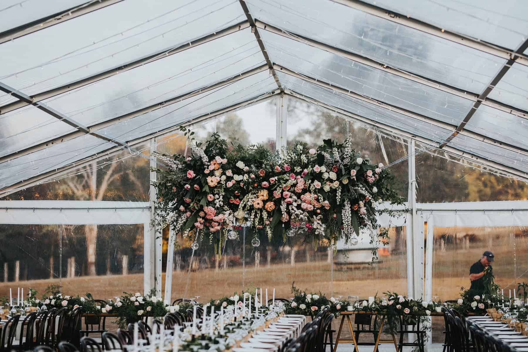 modern marquee wedding with hanging floral installation