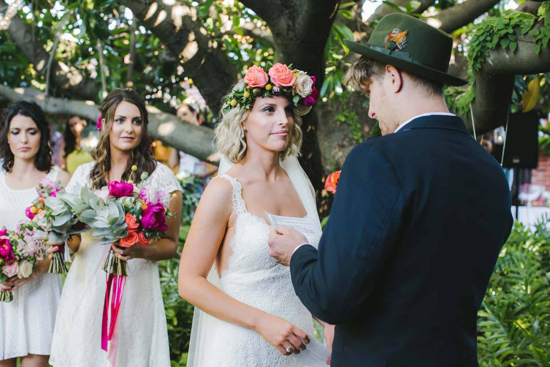 bride wearing colourful flower crown