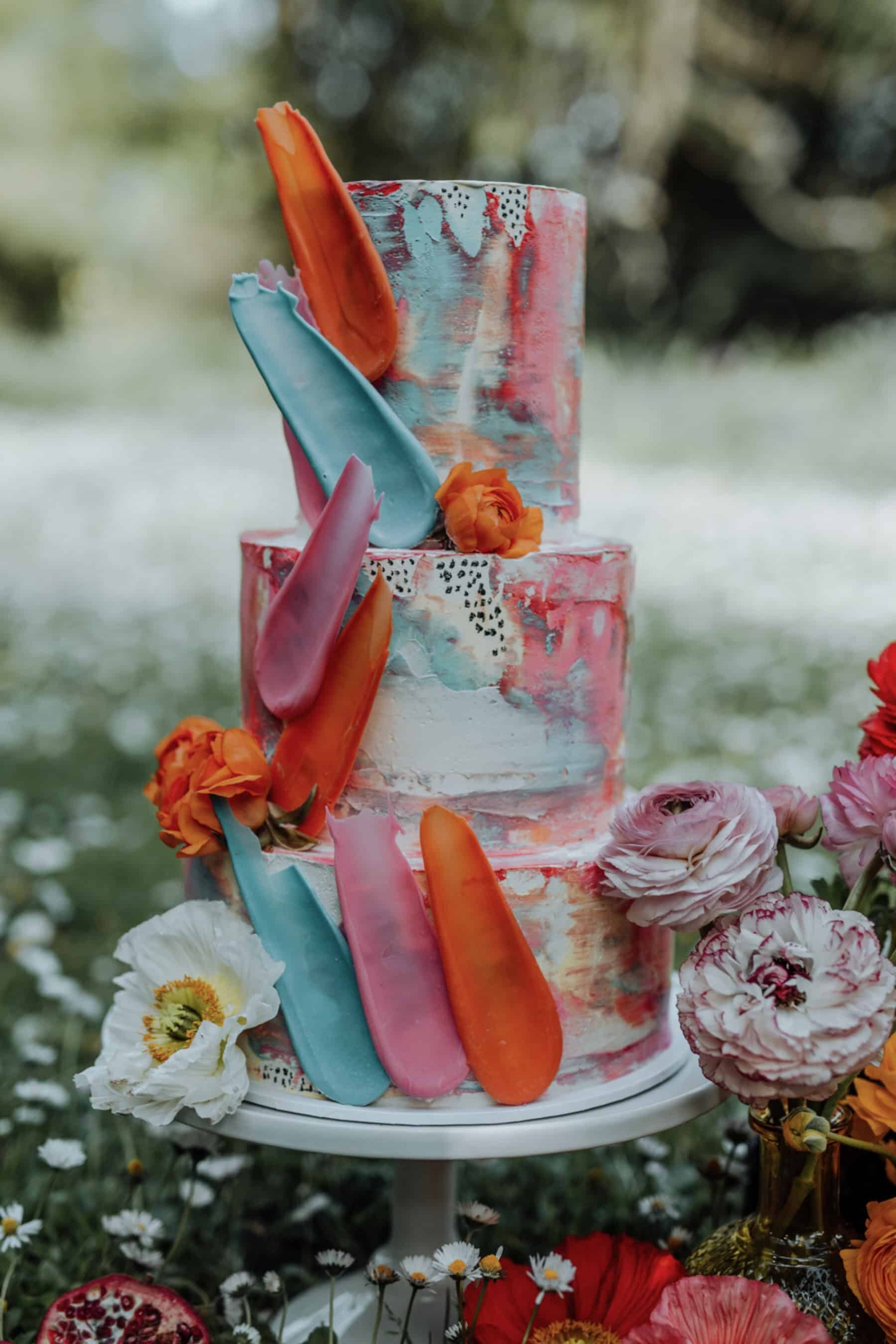 painted wedding cake with colourful brush stroke shards