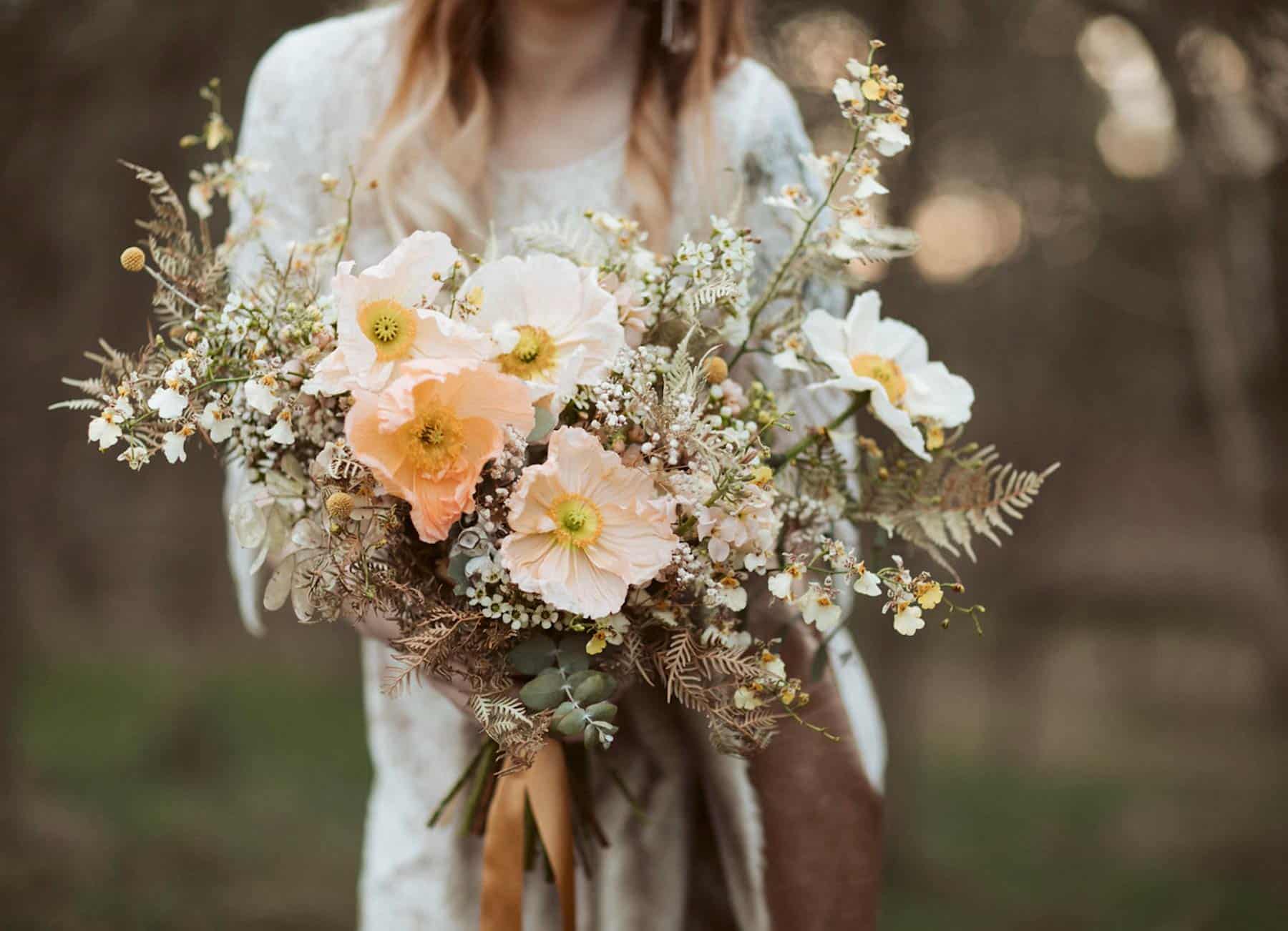 peach toned bridal bouquet with poppies and dried ingredients