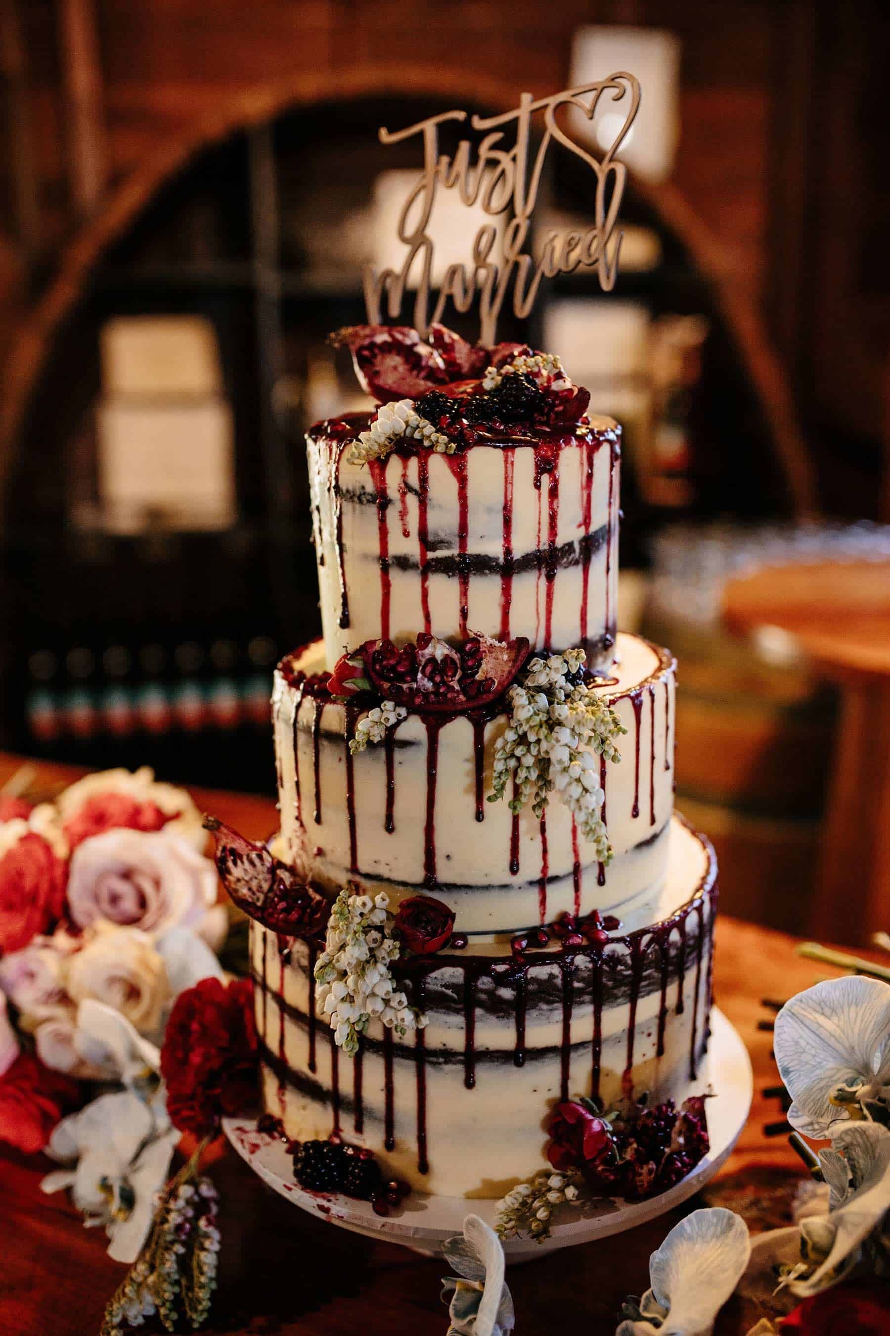 Three tier semi nude wedding cake with acrylic topper