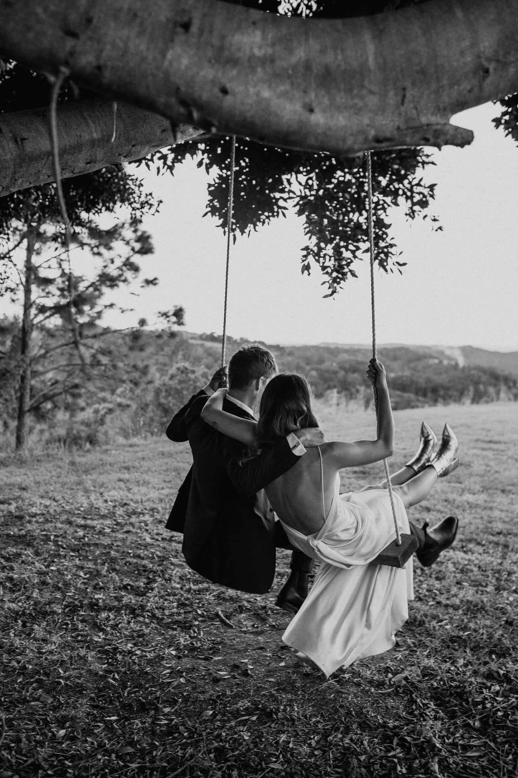bride and groom on swing