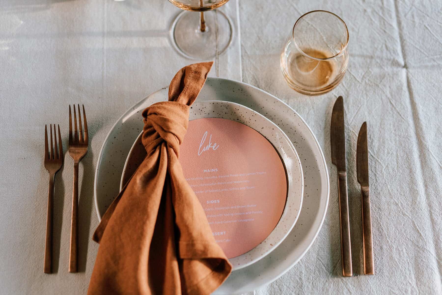 circular menu on a rustic table setting