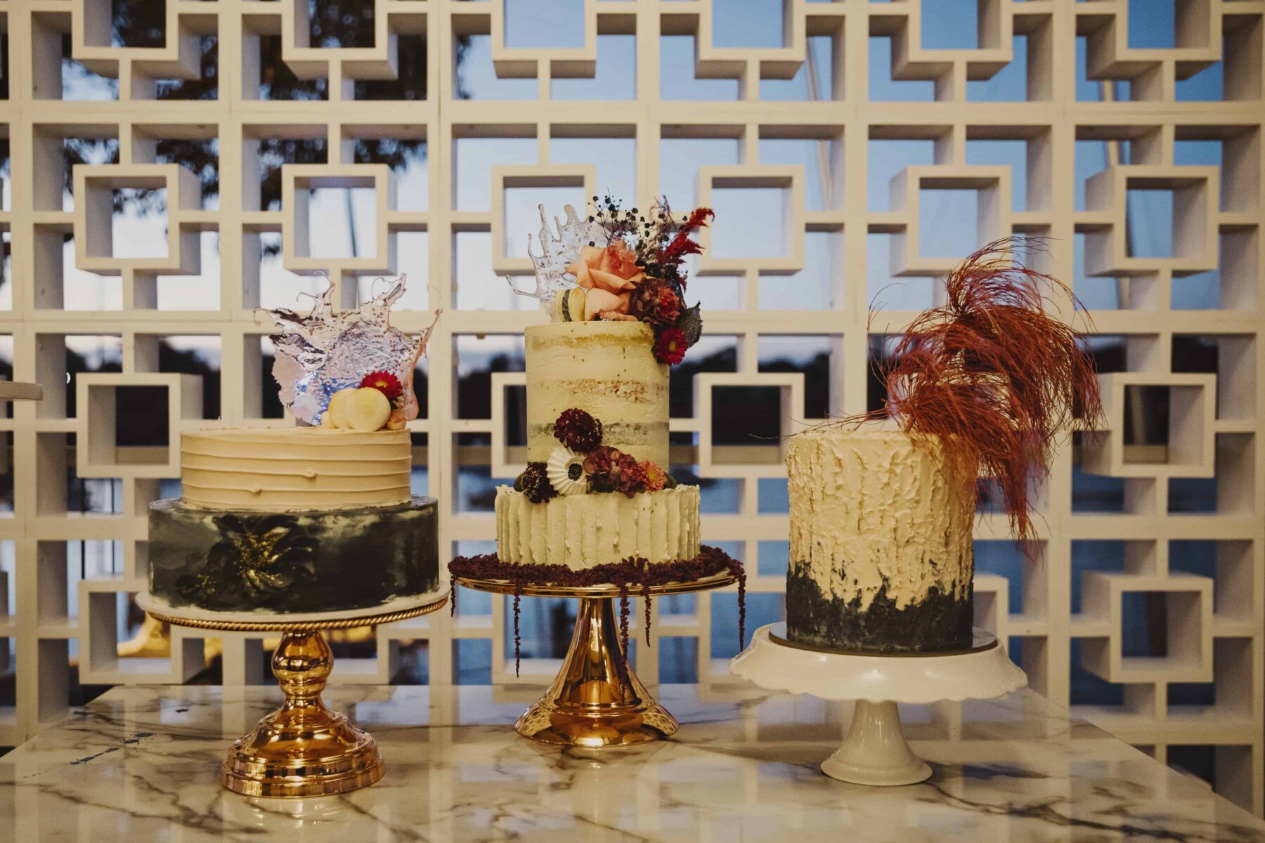 trio of creative wedding cakes