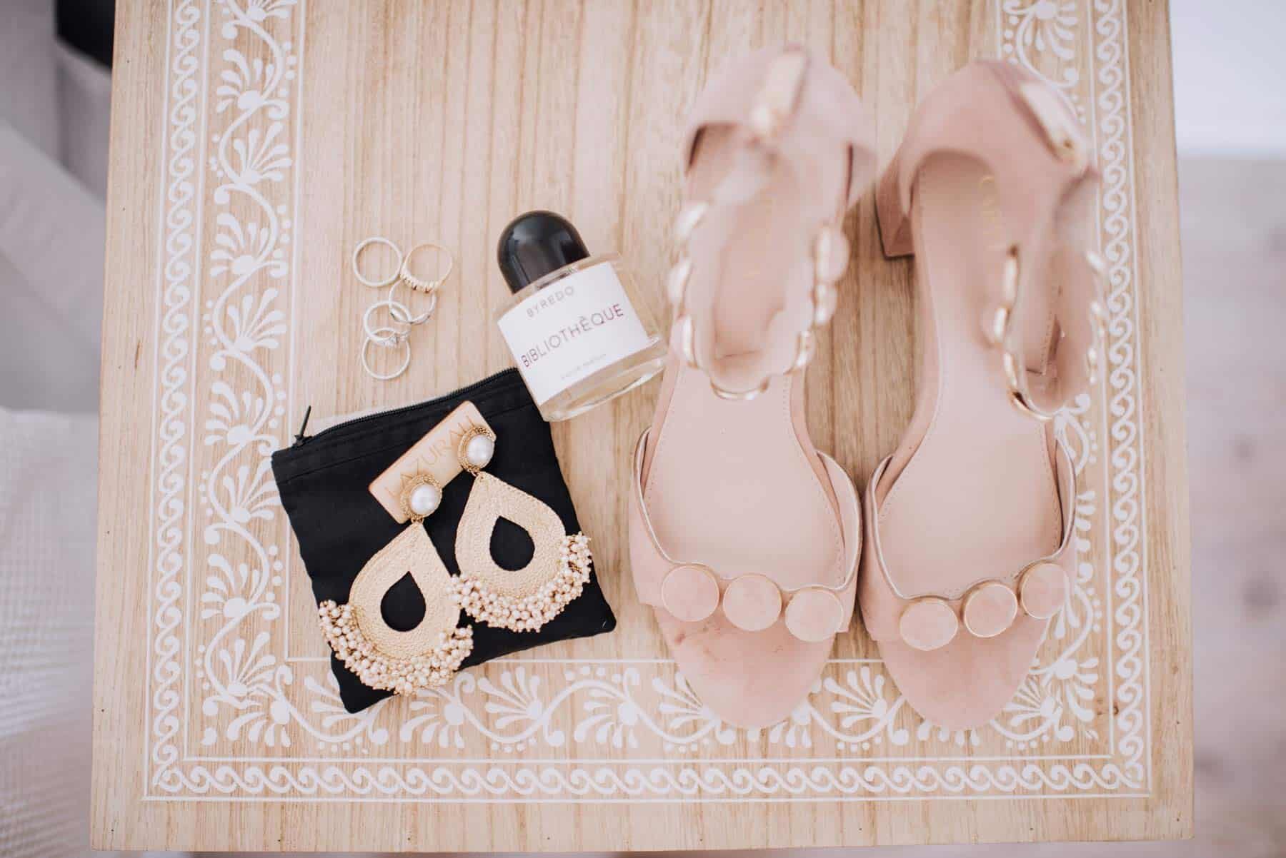 bridal flatlay with shoes and accessories