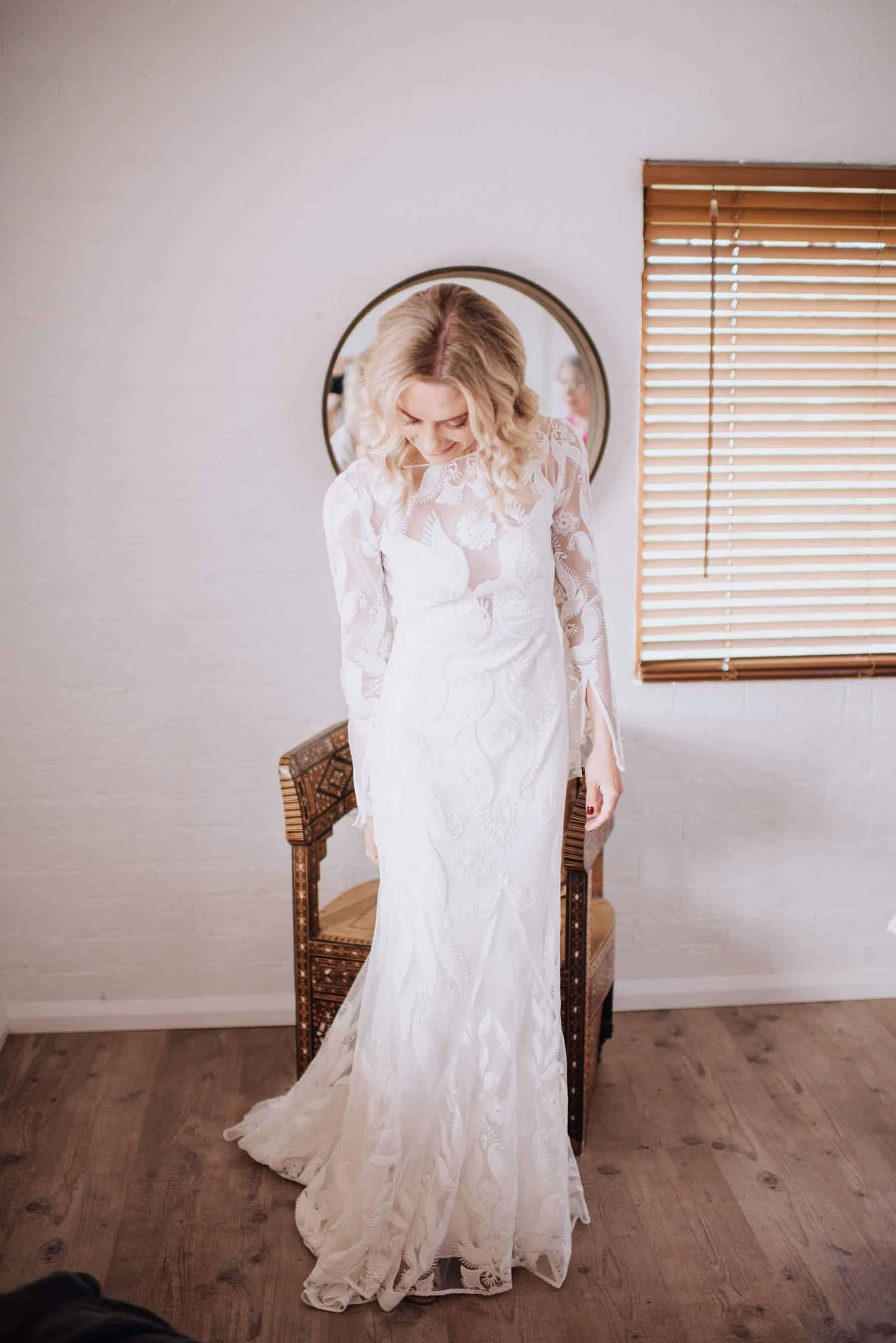 Long sleeve lace wedding dress by Rue de Seine