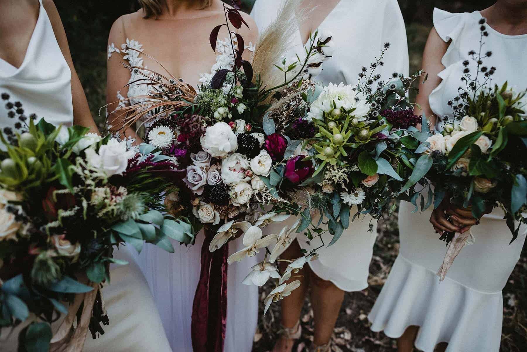 Native rustic wedding flower bouquet with white bridesmaid dresses