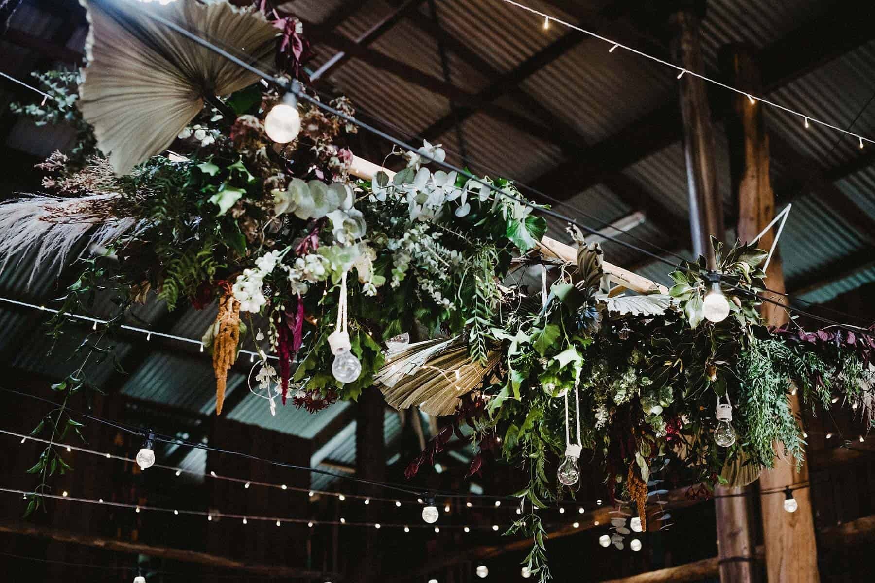 Rustic boho floral wedding reception installation