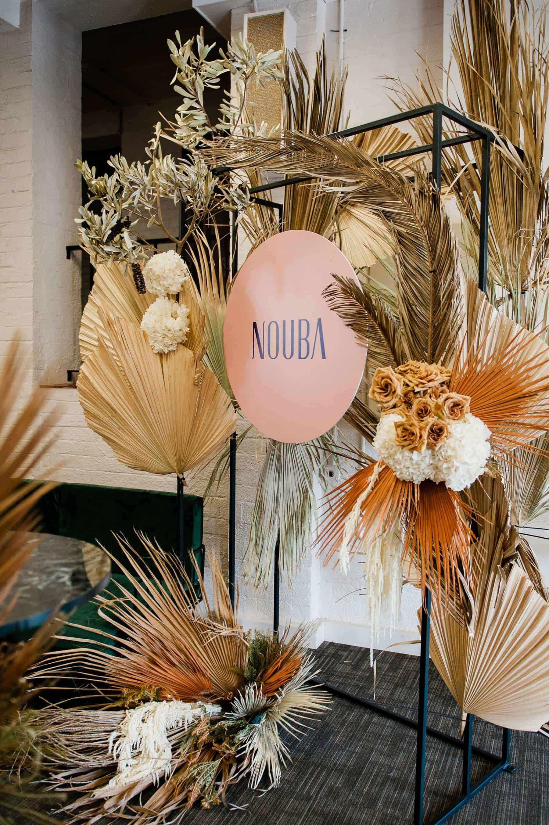 floral installation with dried palm leaves