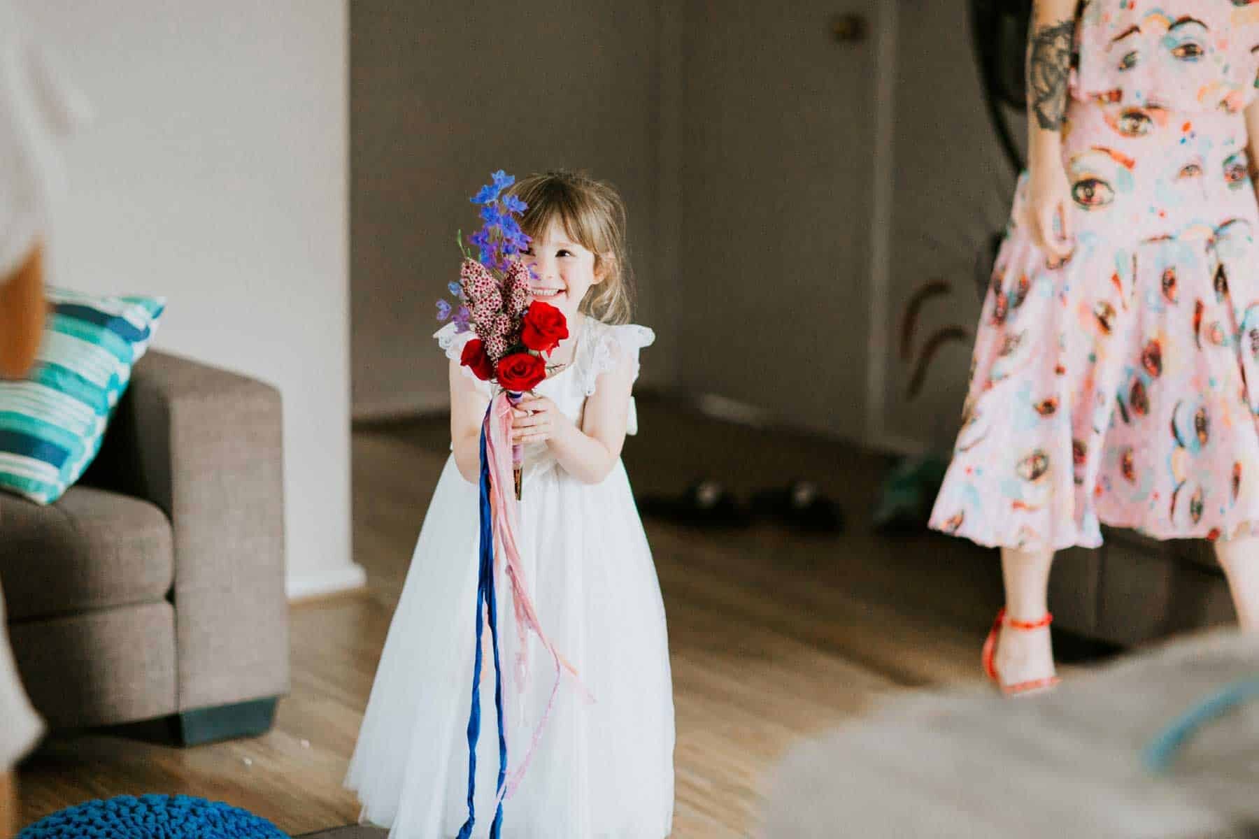 flower girl with colourful bouquet