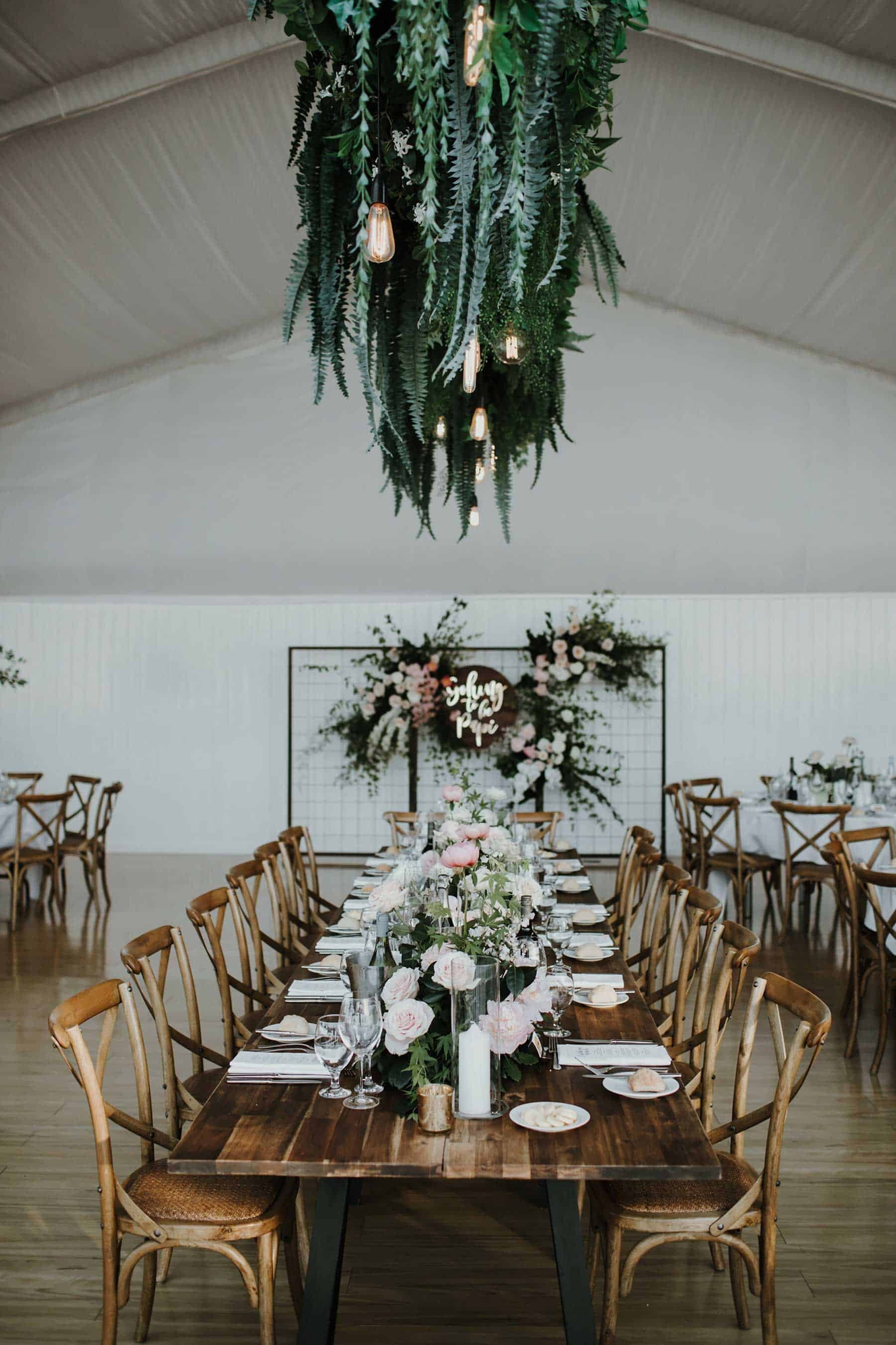modern marquee wedding with hanging flowers