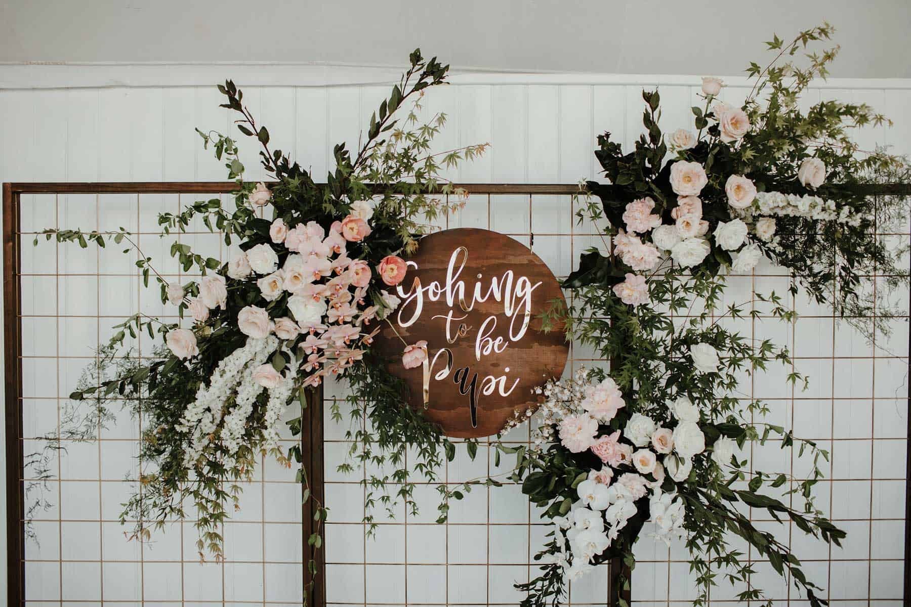 modern wedding signage with flowers
