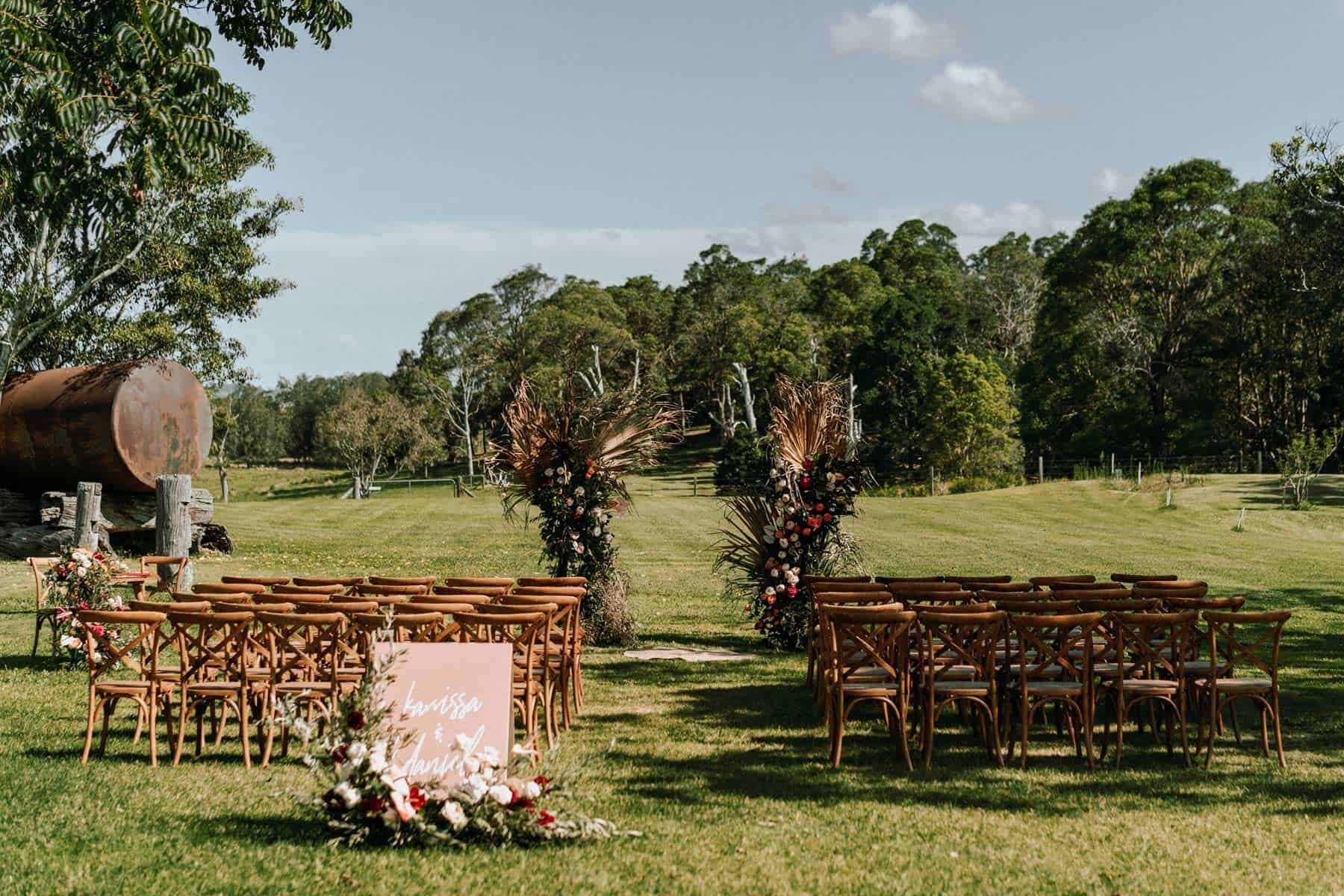 floral arch with dried palm leaves
