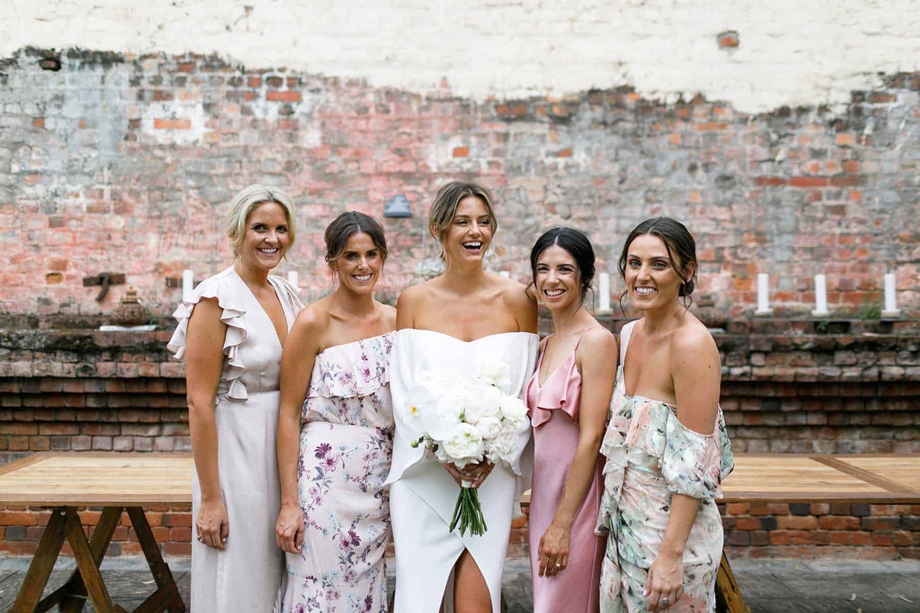 mismatched blush floral bridesmaid dresses