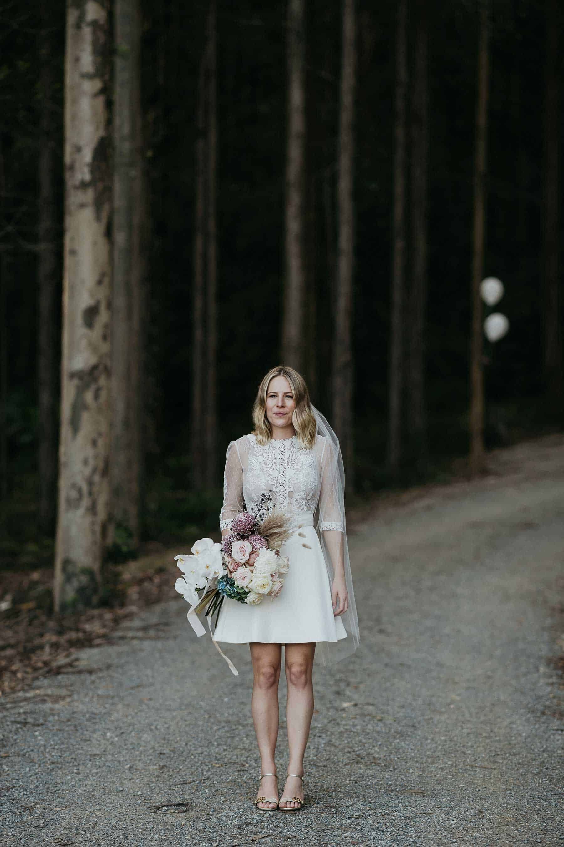 short wedding dress with lace bodice and long sleeves