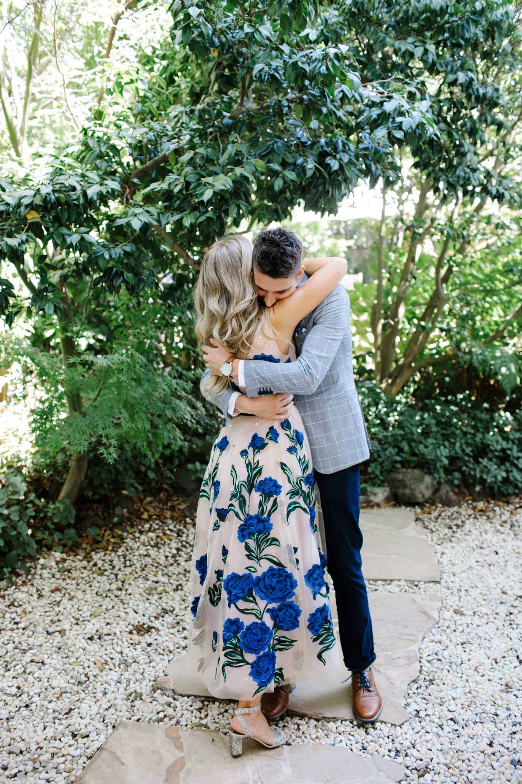 blush wedding dress with blue floral applique