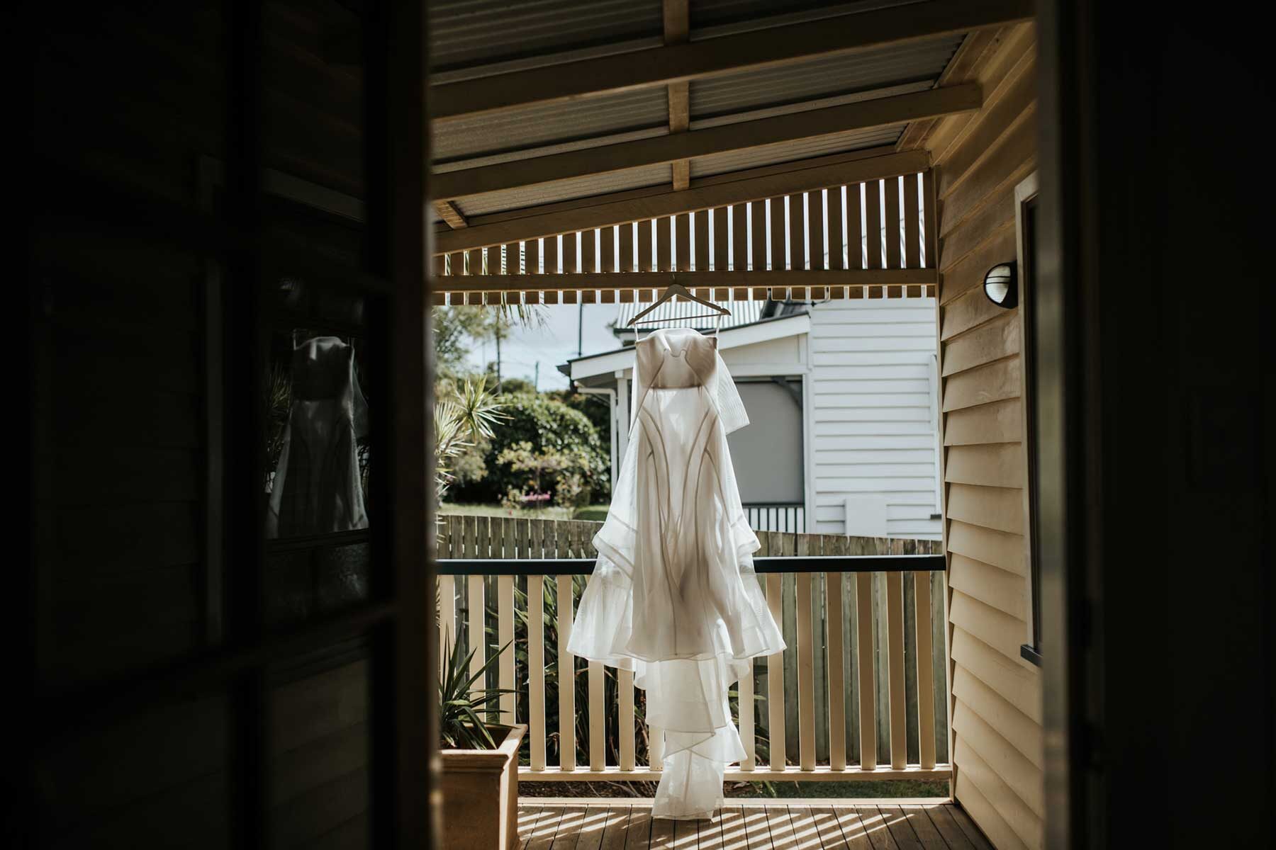 modern structural wedding dress with off-shoulder detail
