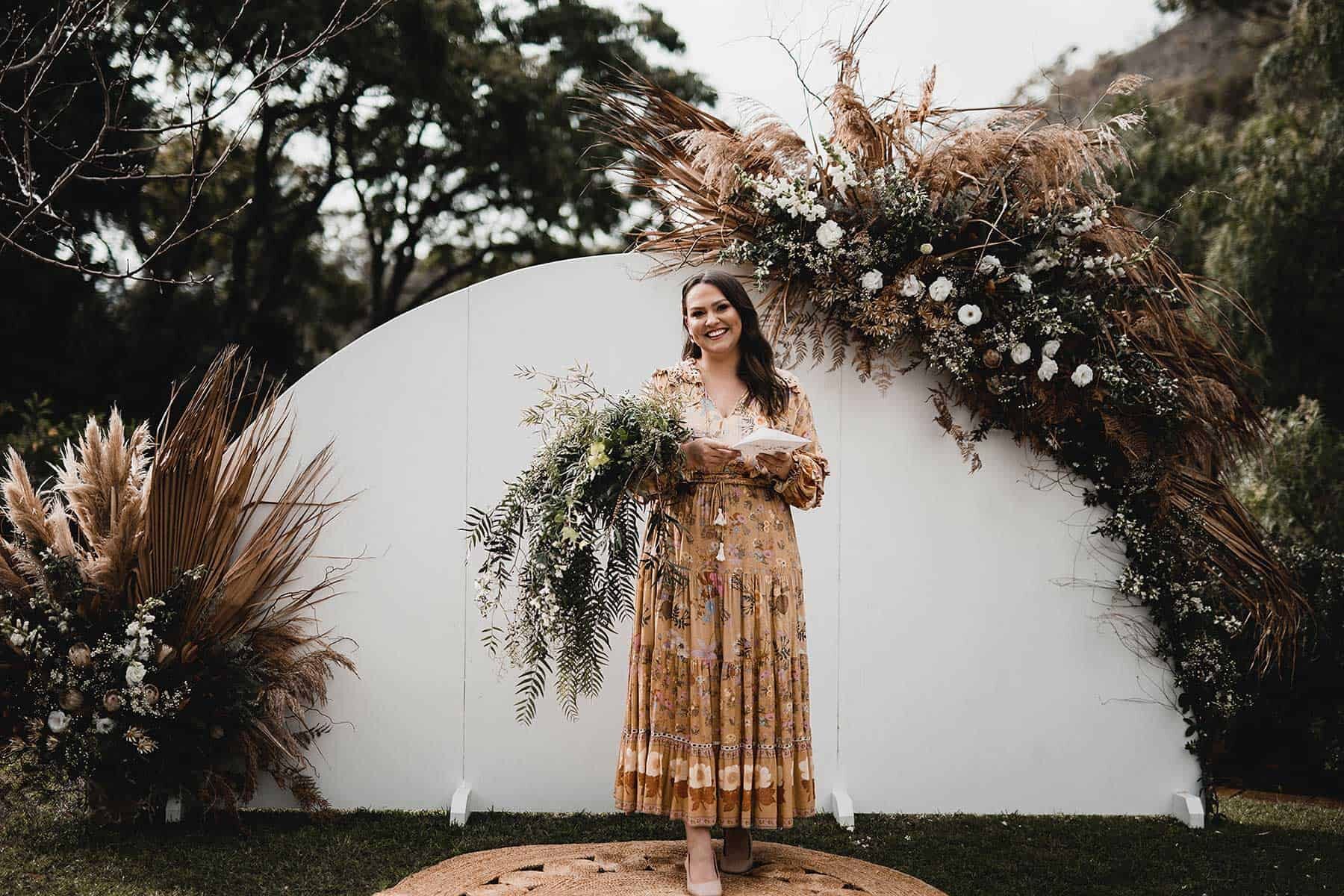 semicircle wedding arbour with dried flowers