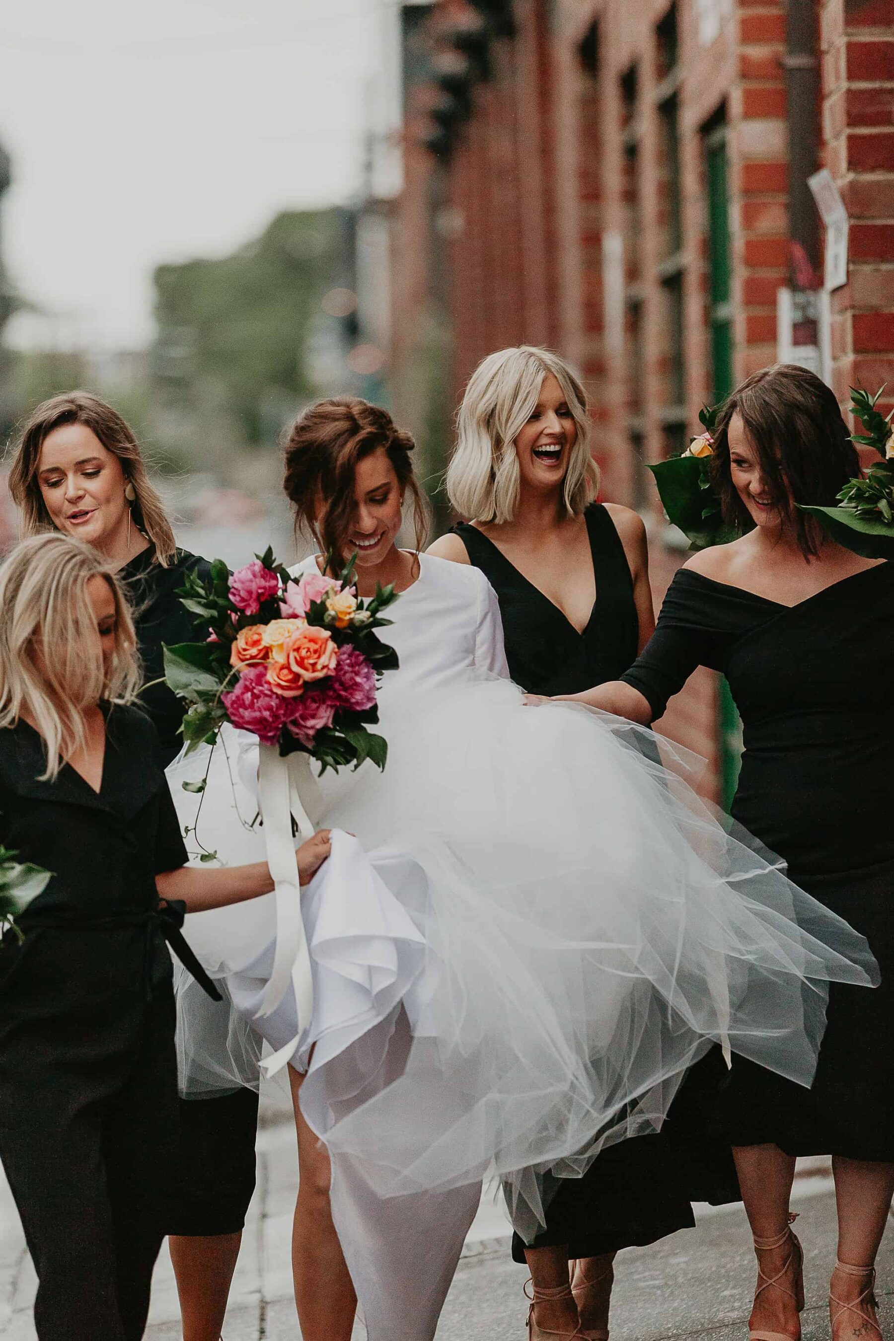 all-in-black bridesmaids dresses