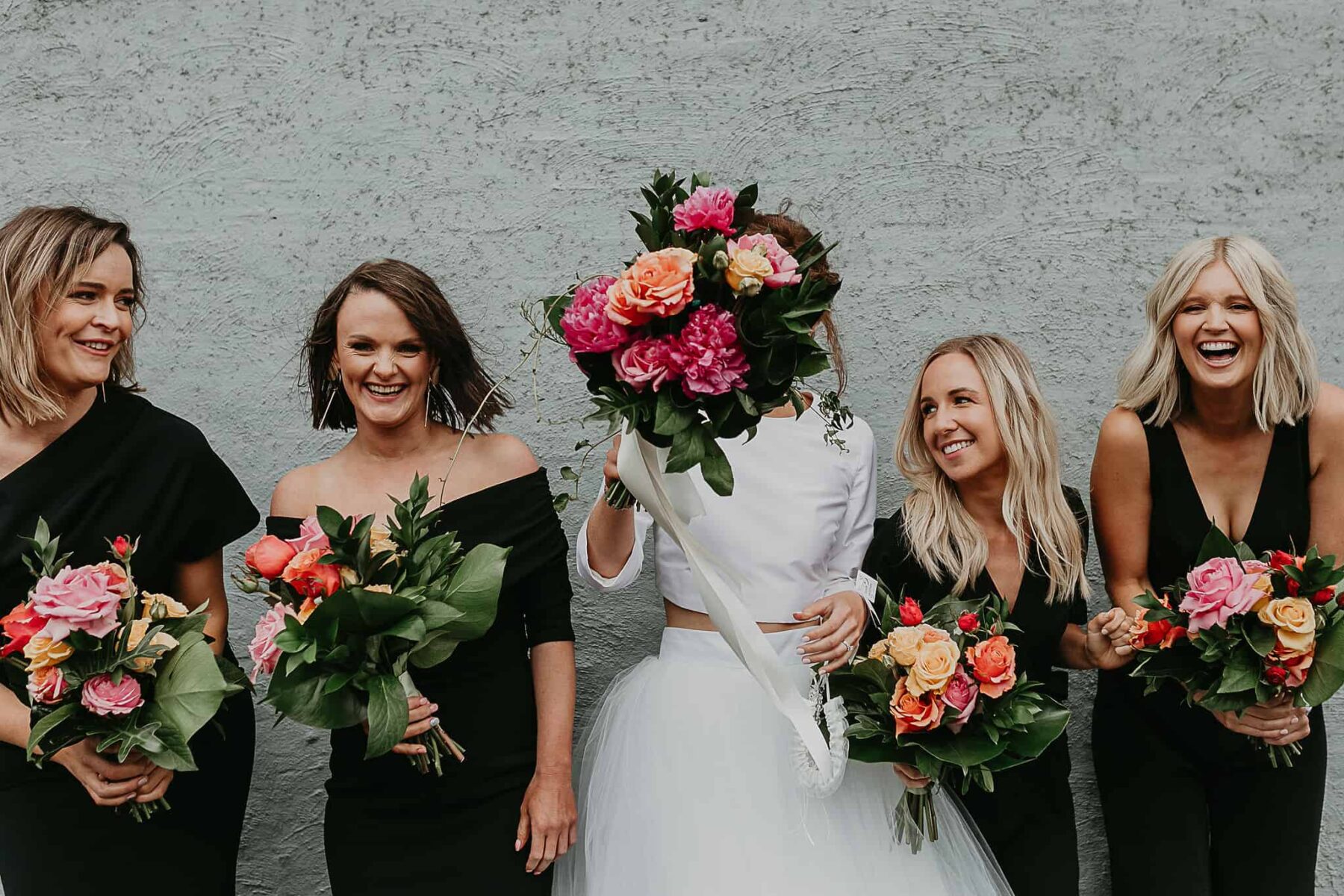 all-in-black bridesmaids dresses