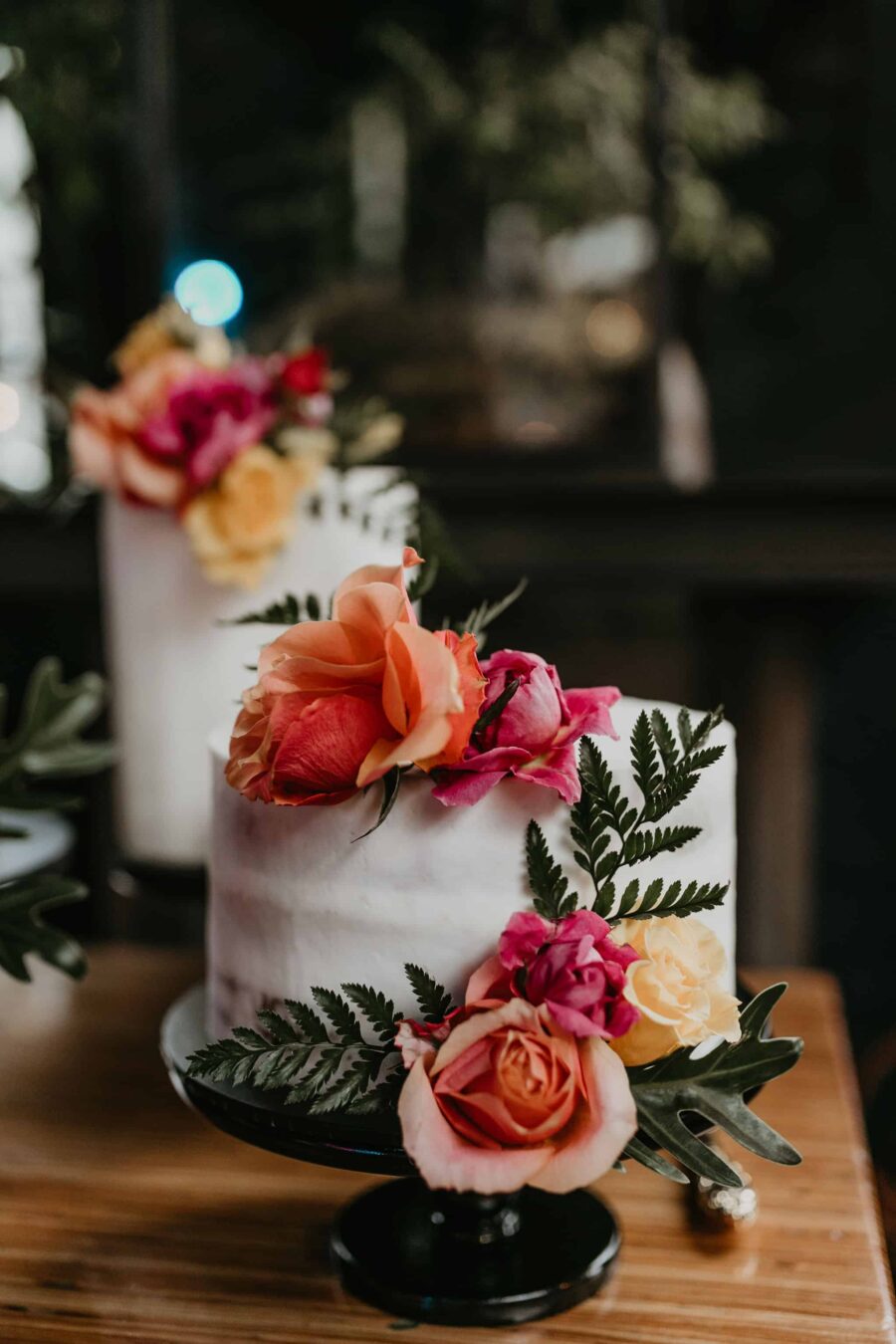 simple modern wedding cake with fresh flowers
