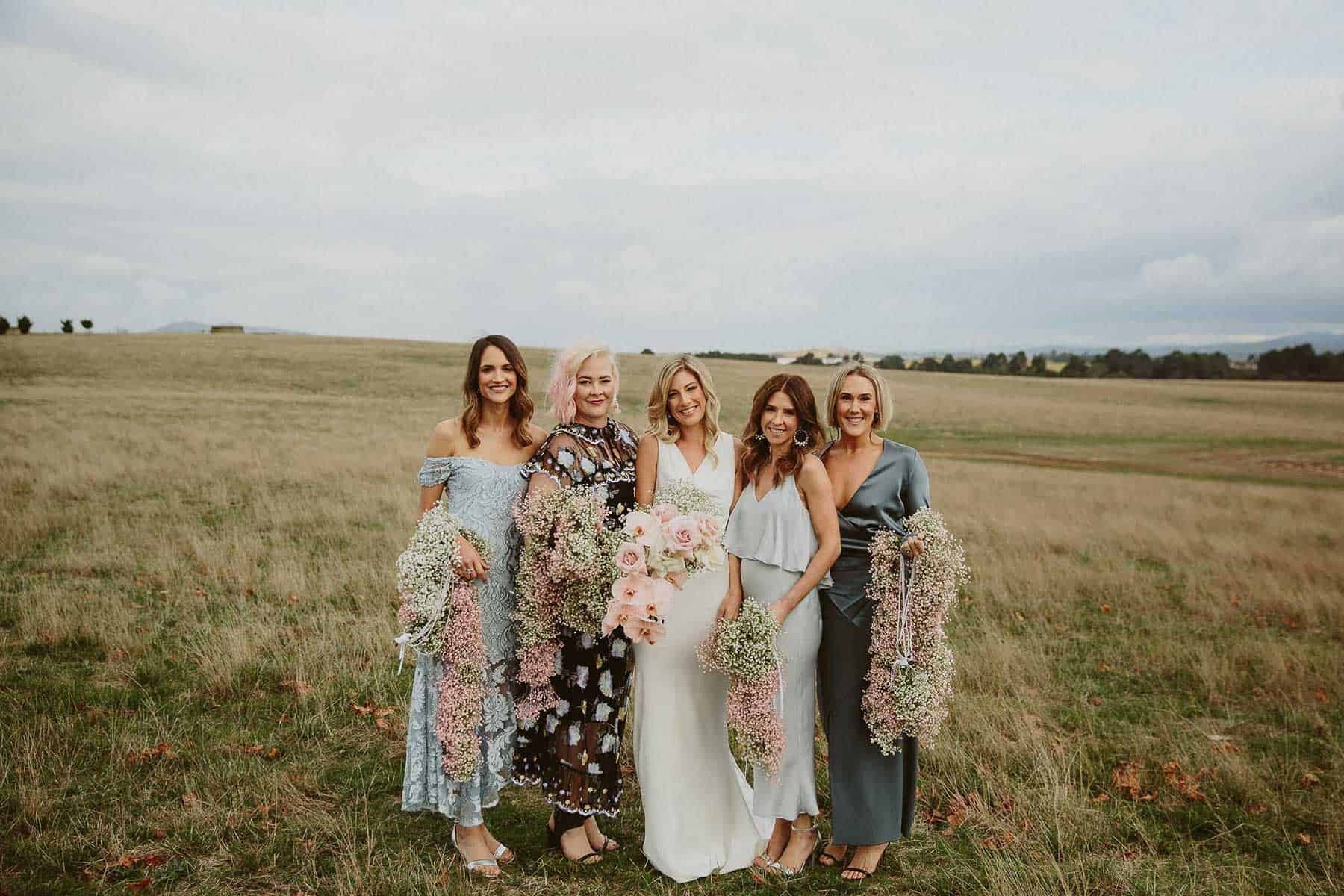mismatched bridesmaid dresses in mixed blue hues