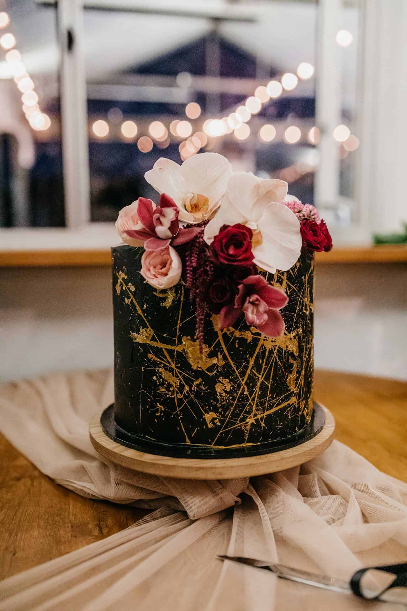 black wedding cake with gold fleck