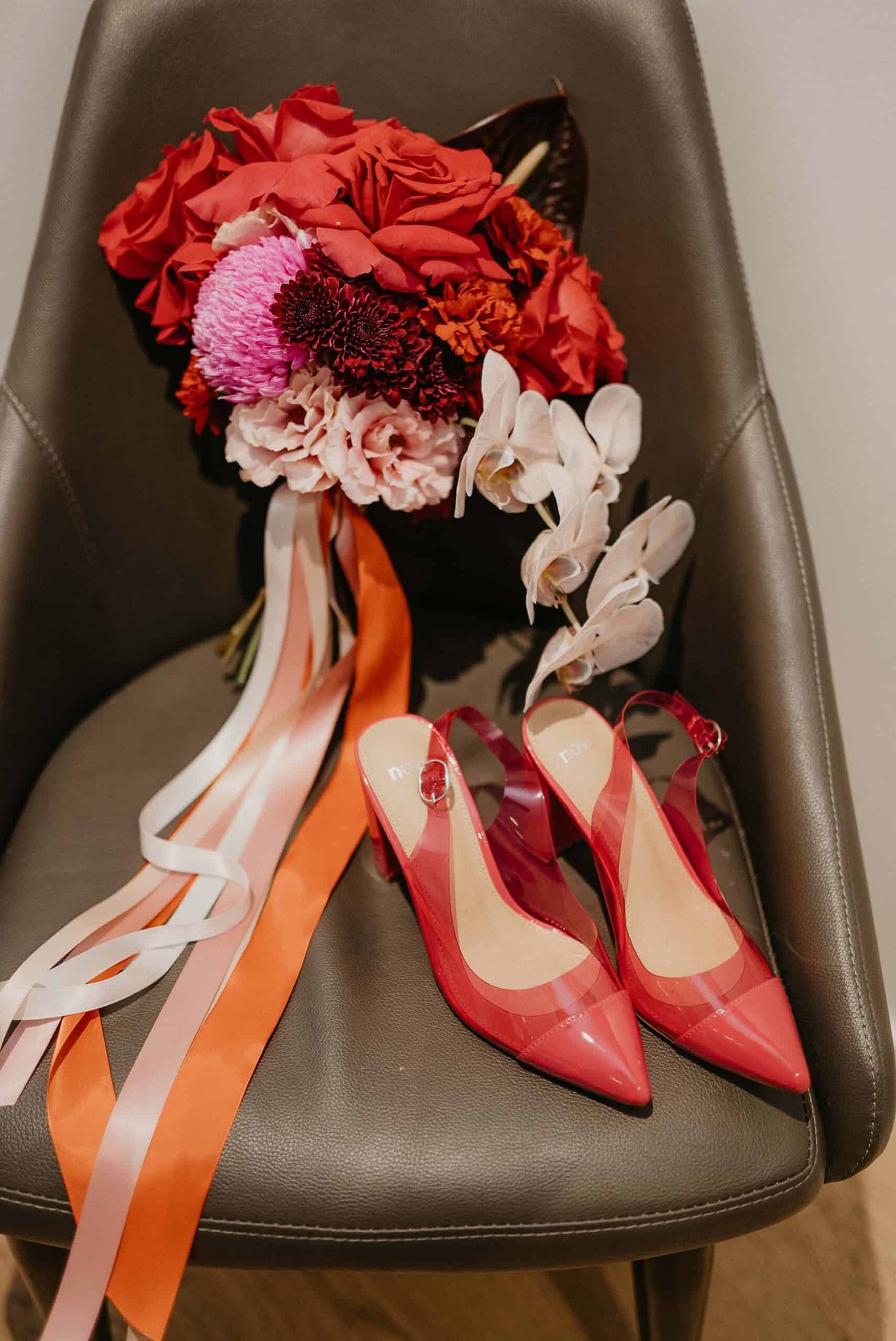 Red flower bouquet and matching heels